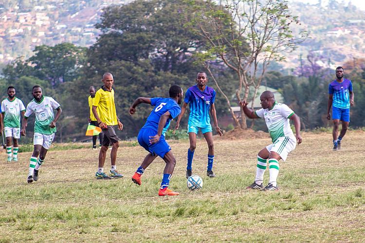 MUBAS students playing football against staff and police